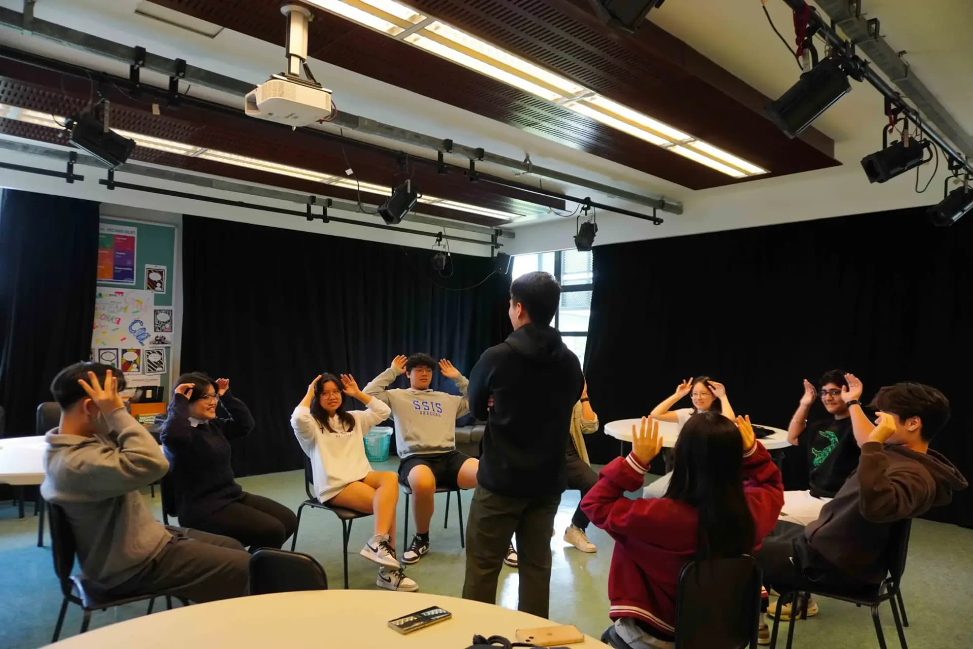 MLV Students playing a game together while sitting in a circle