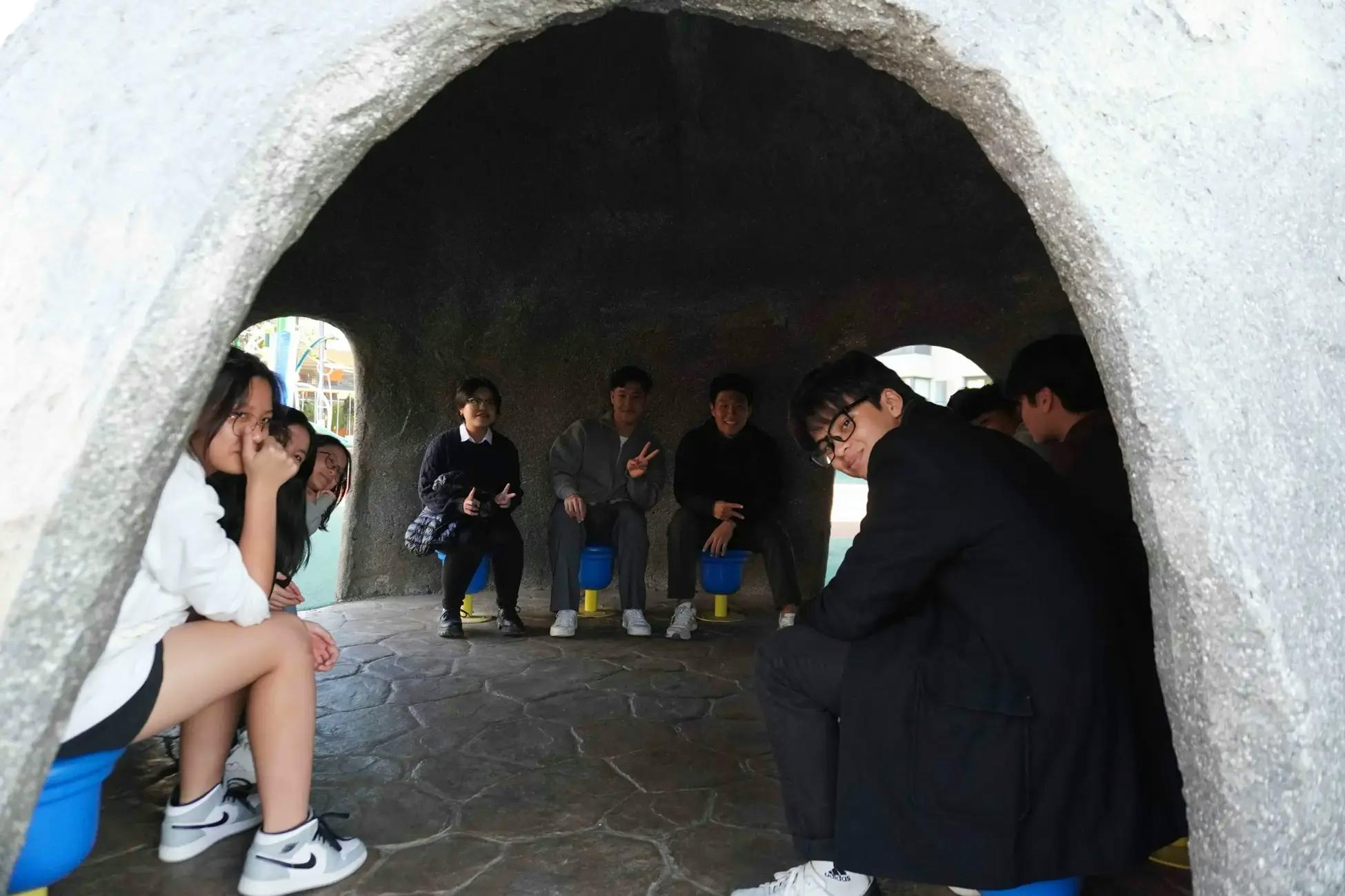 Group photo of a students in a cave at a park